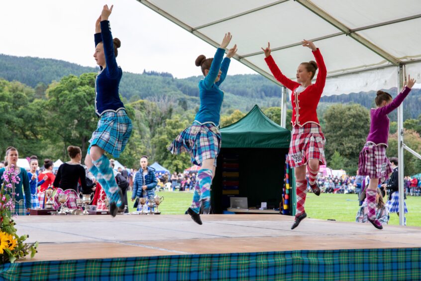 Highland dancers take centre stage with the lovely scenery of Pitlochry behind. 