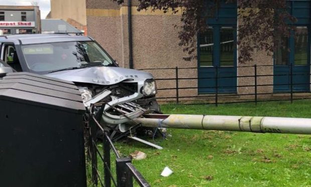 A Land Rover crashed into railings and a pole on Strathmore Avenue. James Simpson/DC Thomson