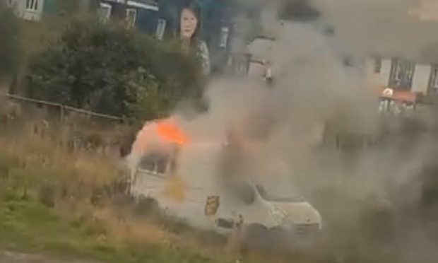 The van was engulfed by flames.