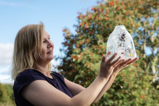 Elin Isaksson with one of her handmade vases. Image: Eve Conroy/ DC Thomson