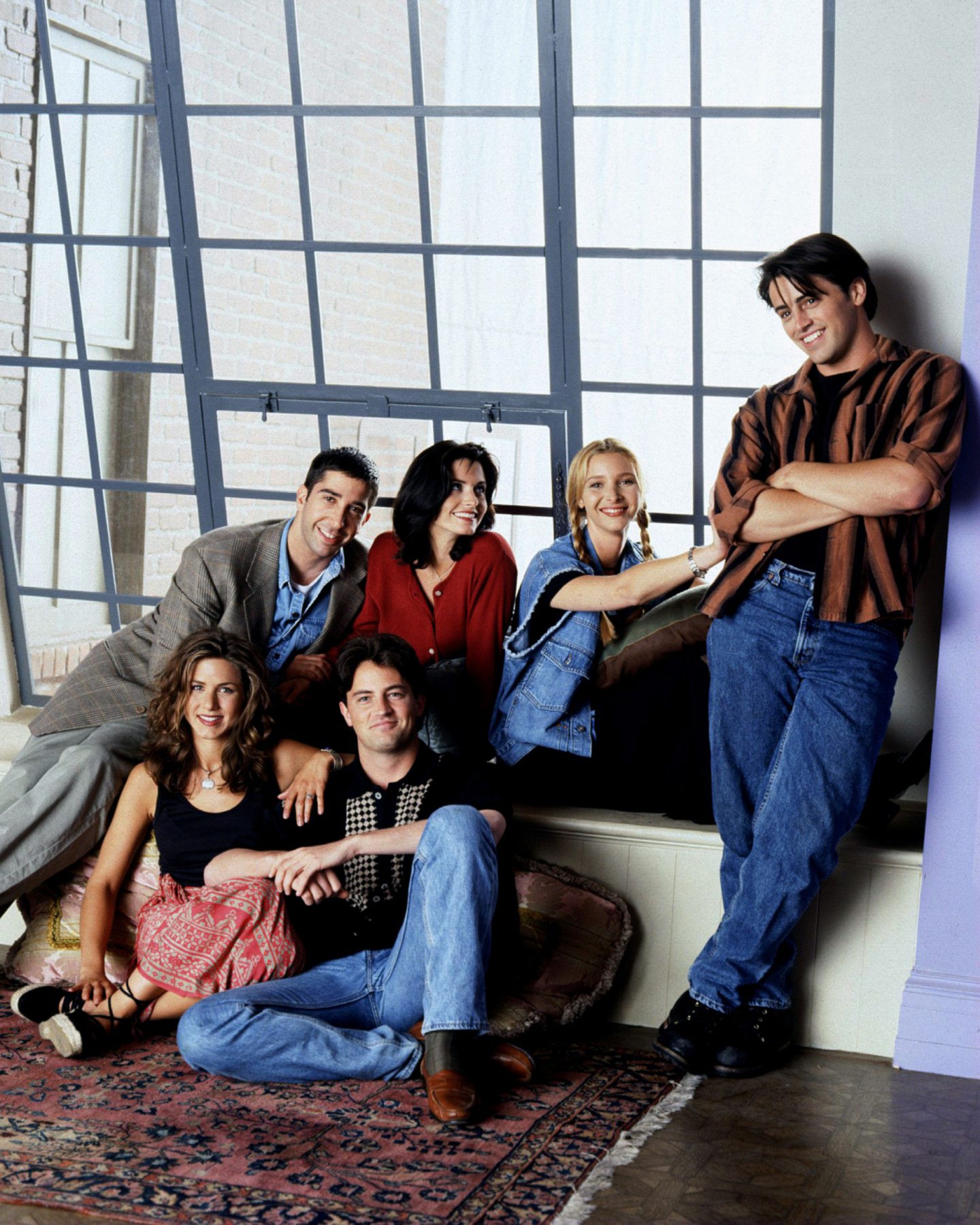 A promotional shot of the Friends cast in Monica's apartment before the pilot episode in 1994. 