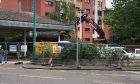 Work has started on the demolition of the old petrol station on West Marketgait, Dundee. Image: James Simpson/DC Thomson