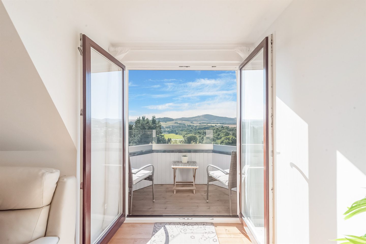 Doors leading to the private balcony.