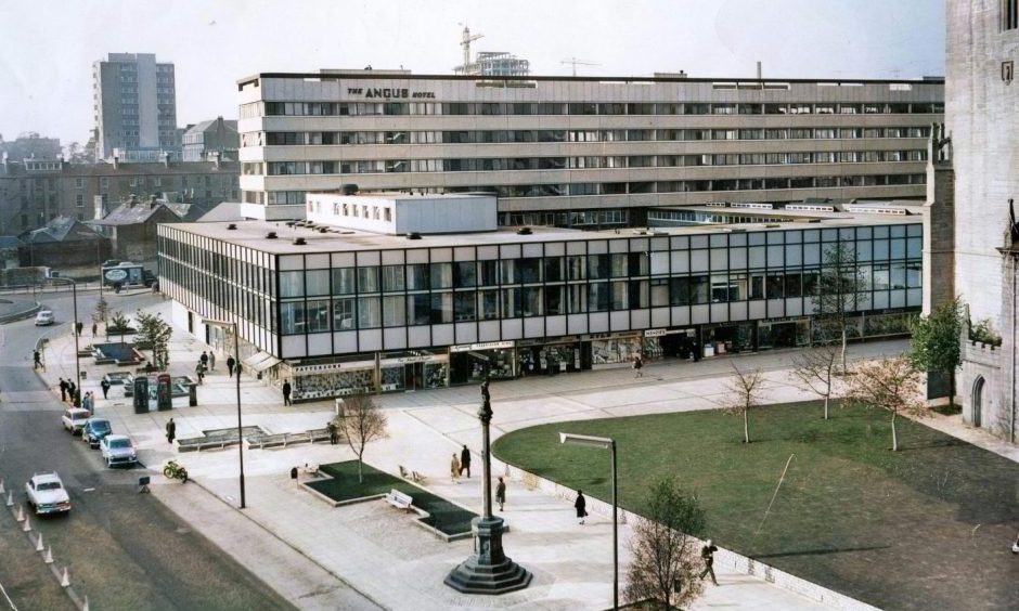 this colourised photo shows an aerial view of The Overgate and Angus Hotel in Dundee in 1965.