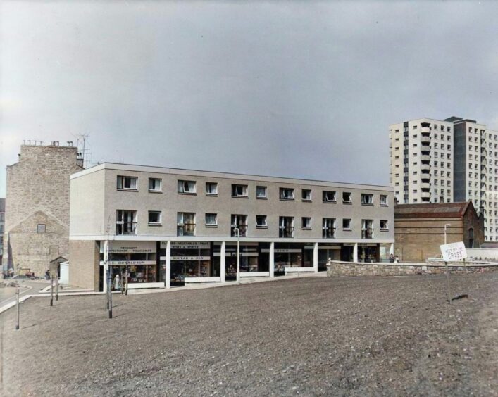 a parade of shops, tenements and high-rise flats in the Whorterbank estate in May 1963.