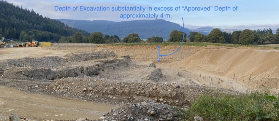 Borrow pit, or quarry, showing depth of excavation