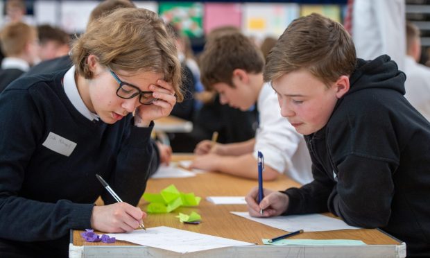 Two pupils ponder a maths problem at Enterprising Maths Fife 2024