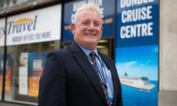 John Stewart outside his Dundee city centre Hays Travel branch. Image: Kim Cessford/DC Thomson