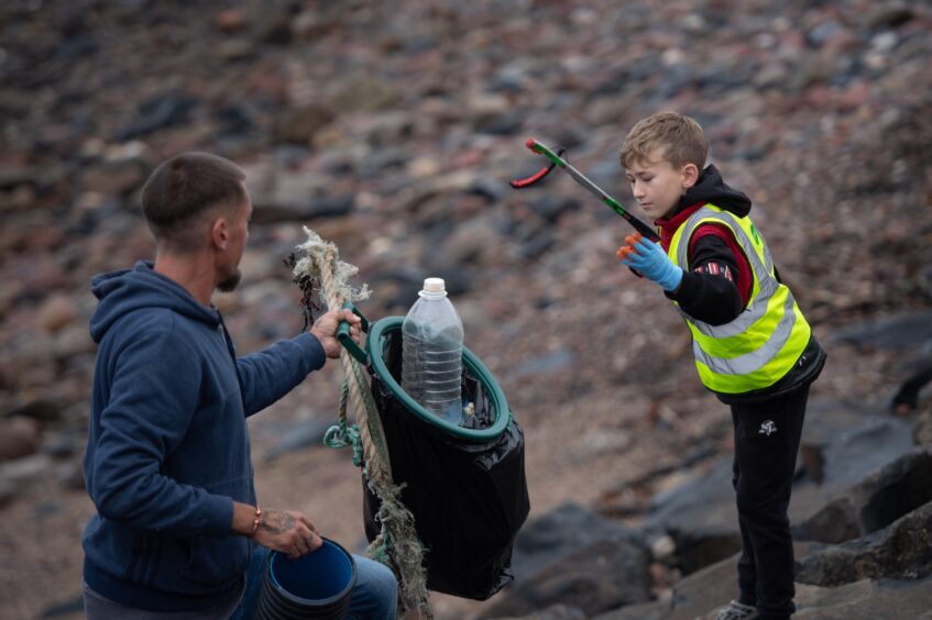 Litter picking at Arbroath beach.