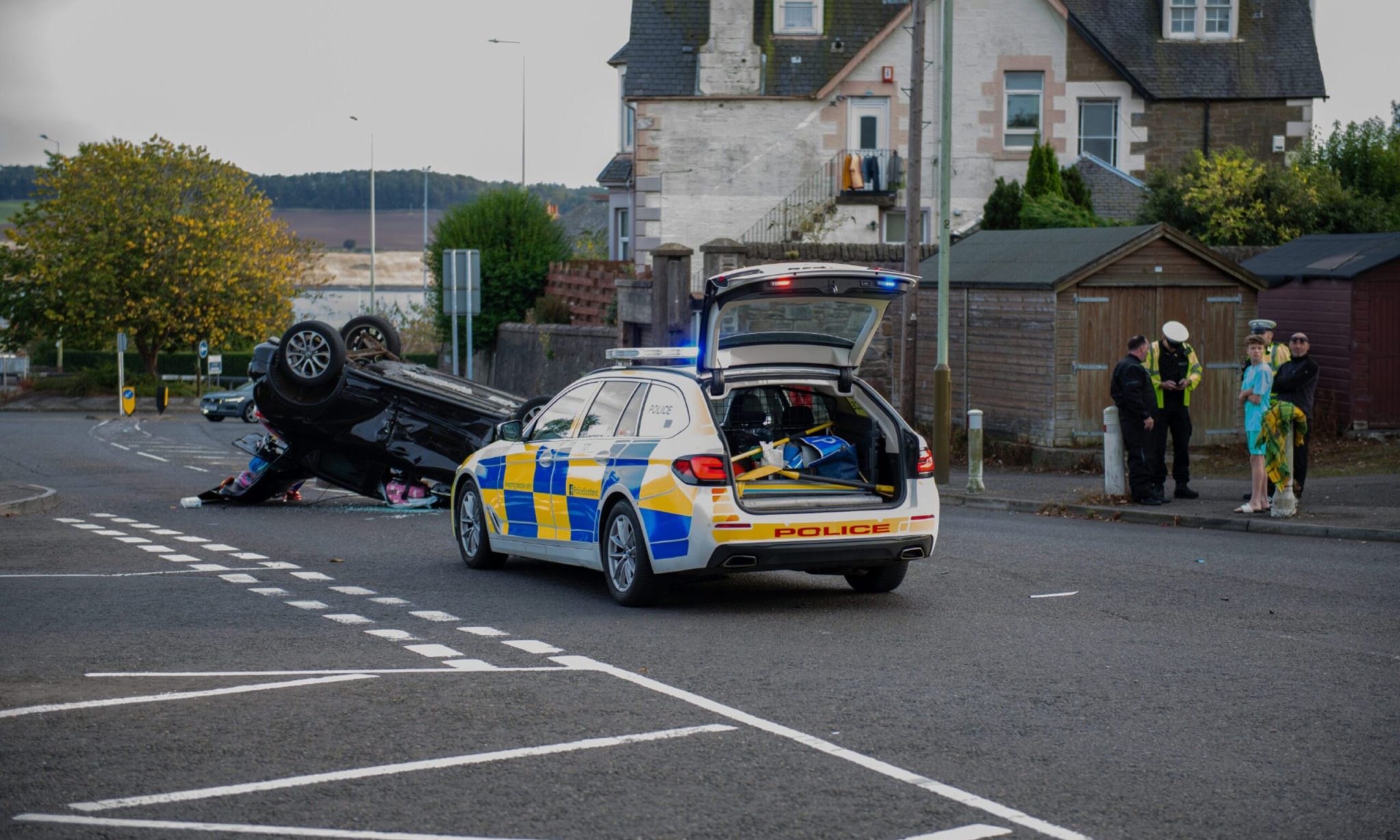 Strips of Craigie Road Car flips onto roof after crash in Dundee