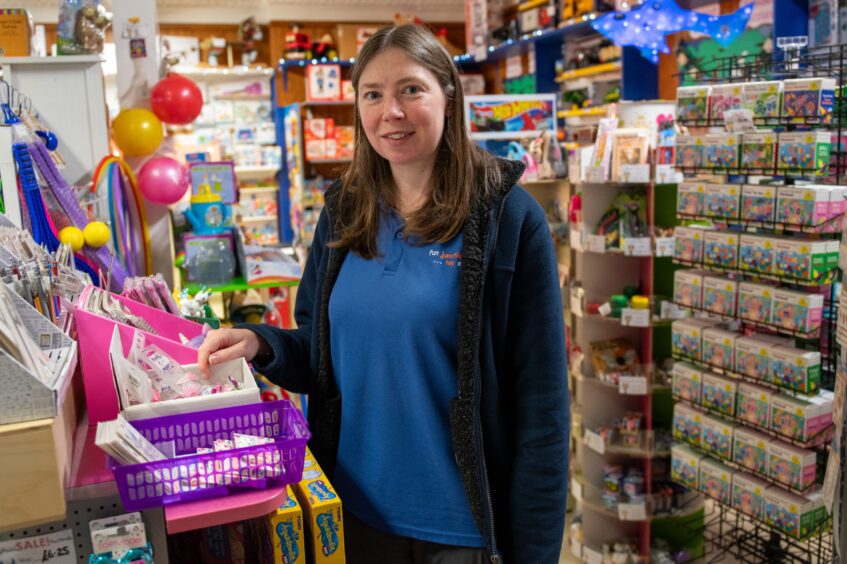 Jenny Christie in front of toy displays in Fun Junction shop, Perth