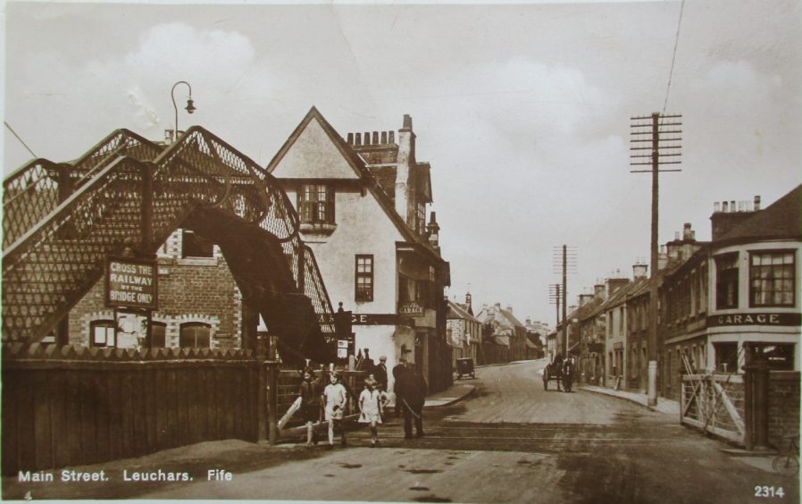 Leuchars Main Street in the early 1930s showing Ye Olde Hotel next to the now decommissioned railway.