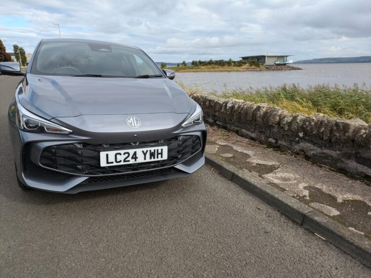 the car parked beside water