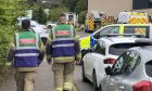 Firefighters in hazmat outfits at Crieff Primary School. Image: James Simpson/DC Thomson