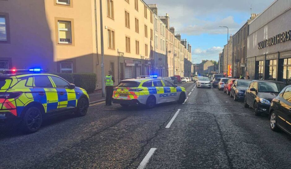 Two police cars on Strathmartine Road in Dundee.