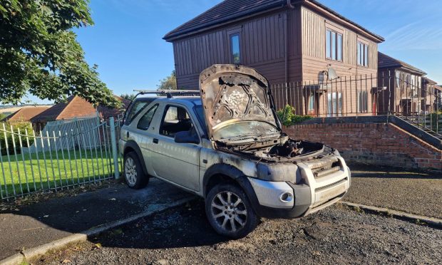 A burnt out car on Pitkerro Road in Dundee.