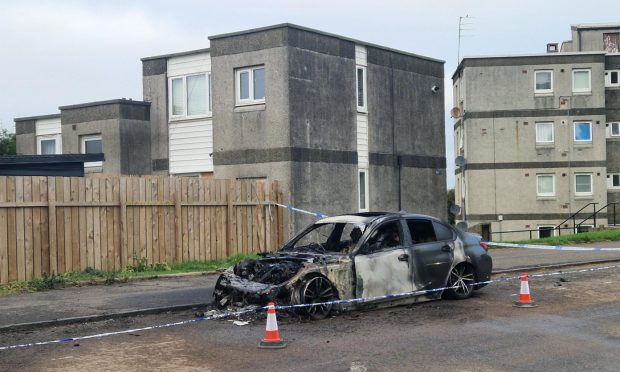 One burnt-out car on Charleston Drive.