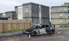 One burnt-out car on Charleston Drive.