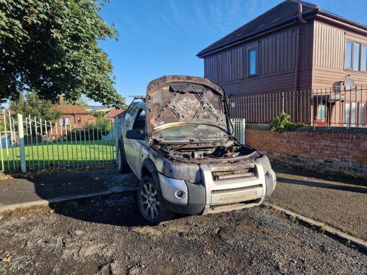burned-out car on Pitkerro Road