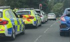 Police stopping a car on Coupar Angus Road in Dundee.