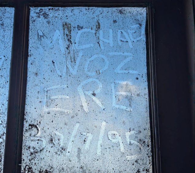 Graffiti written by Michael Alexander on a dirty window behind the stage at the New Picture House on his last night working there in July 1995.