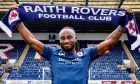 New signing Fankaty Dabo holds up a Raith Rovers scarf.