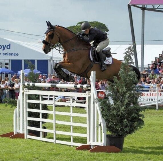 Nicola is pictured show jumping at the Royal Highland Show.