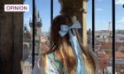 Rebecca looks out over the city of Prague from the tower of its Astronomical Clock. Image: Supplied/DC Thomson.