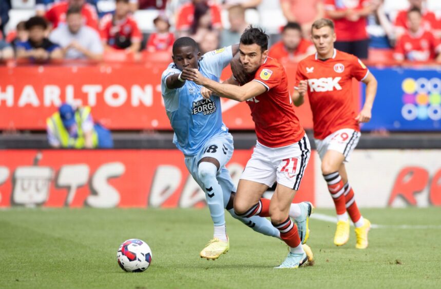 Scott Fraser goes past an opposition player while at Charlton. 