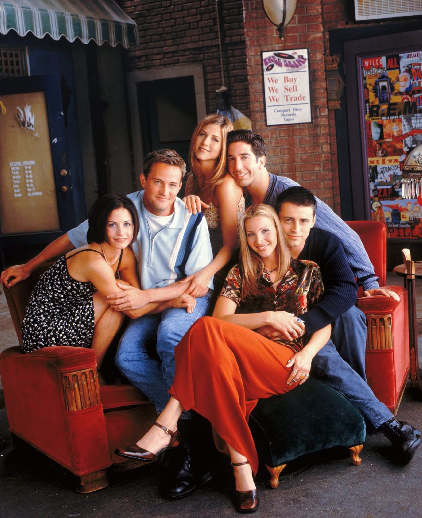 A promotional photograph of the Friends cast on the Central Perk couch 