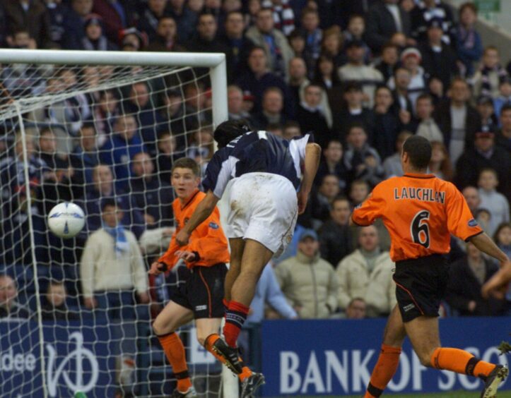 Caballero scores his first goal against United in November 2002 with a header in the box