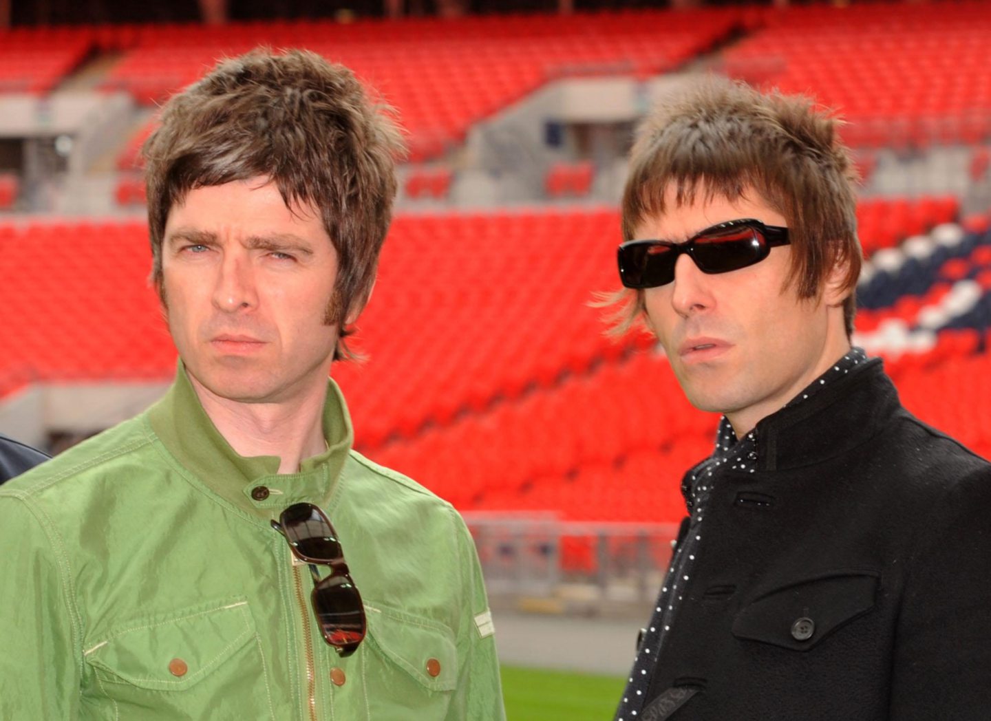 Noel and Liam Gallagher, of Oasis, in an empty stadium