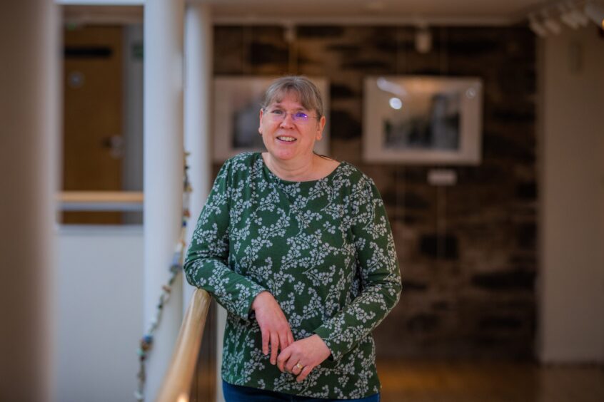 Ruth Brown leaning against stairs at Birnam Arts