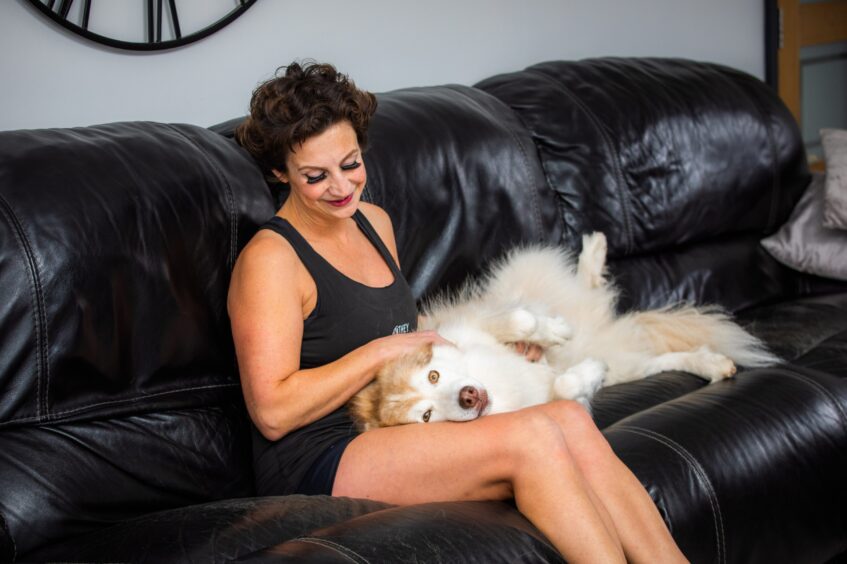 Jaime pictured at home in Arbroath with her dog Hannah.