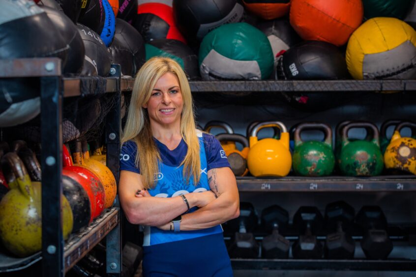 Clayport CrossFit gymgoer Nicola McArthur beside some weights and medicine balls