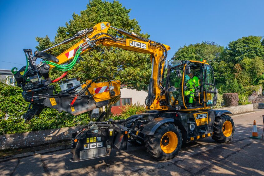 pothole machine in quiet residential street in Rattray