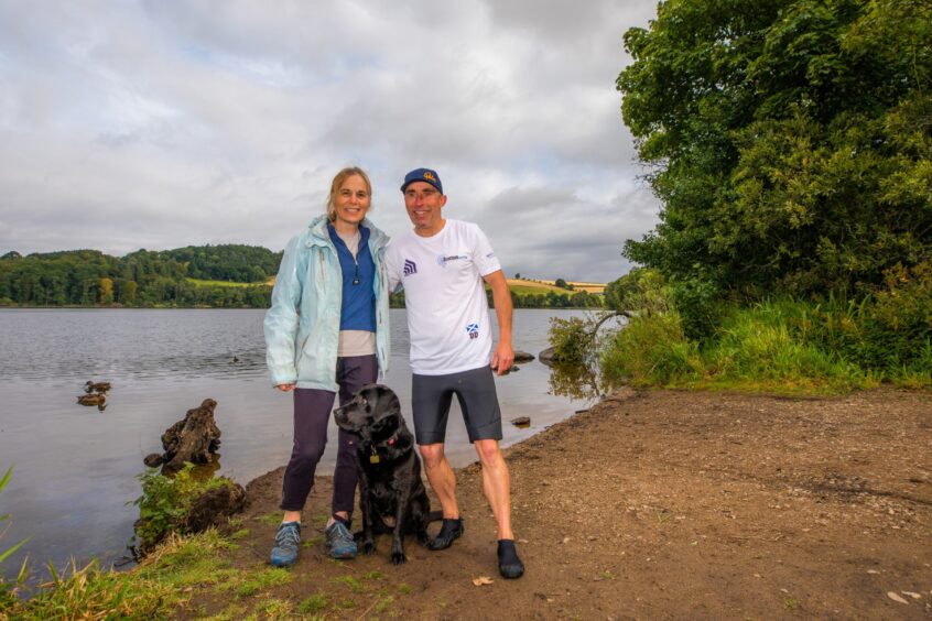 Dean alongside his wife Rhona and their dog Molly at Clunie Loch near Blairgowrie.