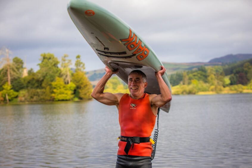 Dean Dunbar with his prone board on Clunie Loch.