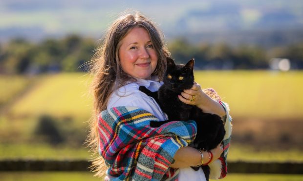 CR0050035 - Rebecca Baird Story  - Stirlingshire area  - BIG INTERVIEW - "ordained Interfaith Reverend, Prosperity Teacher, Somatic Embodiment Coach, Enneagram Mentor" Rev Bunny Love-Schock - Picture shows Rev Bunny Love-Schock and her cat Shadow -- Rednockmill, Blairhoyle, Port of Menteith - Wednesday 25th September 2024   - Image: Steve MacDougall/DC Thomson