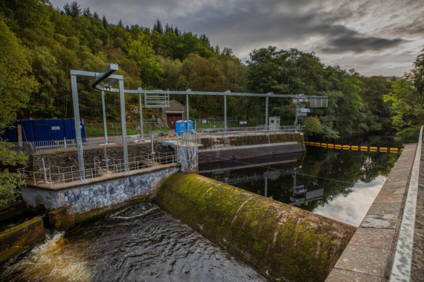 River Earn weir at St Fillans, with tall metal structure above it