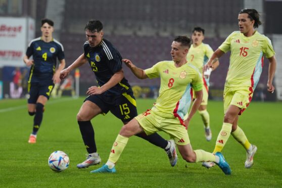 Josh Mulligan takes on Spain at Tynecastle for Scotland U/21s. Image: Andrew Milligan/PA