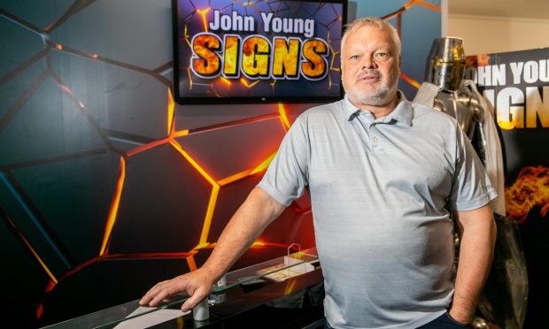 John Young runs his own signage firm in Rosyth. Image: Steve Brown/DC Thomson