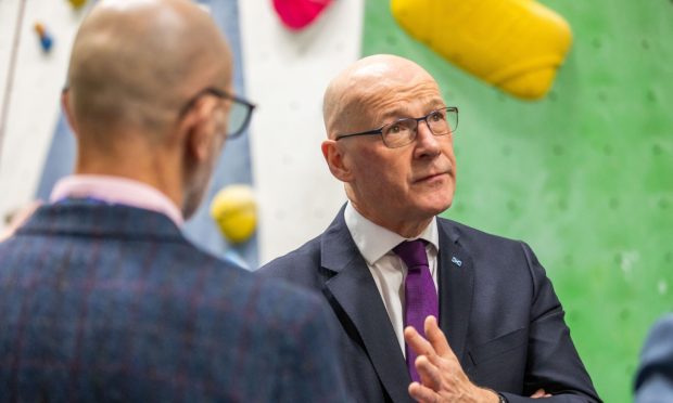 John Swinney, pictured here in Perth, talks politics with his dad, but doesn't now how he votes.