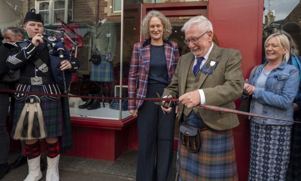 Crieff Highland Gathering chieftain Ron Clark was invited to cut the ribbon on the new Scotland Shop. Image: Lynn Macgregor/ Strathearn Snaps