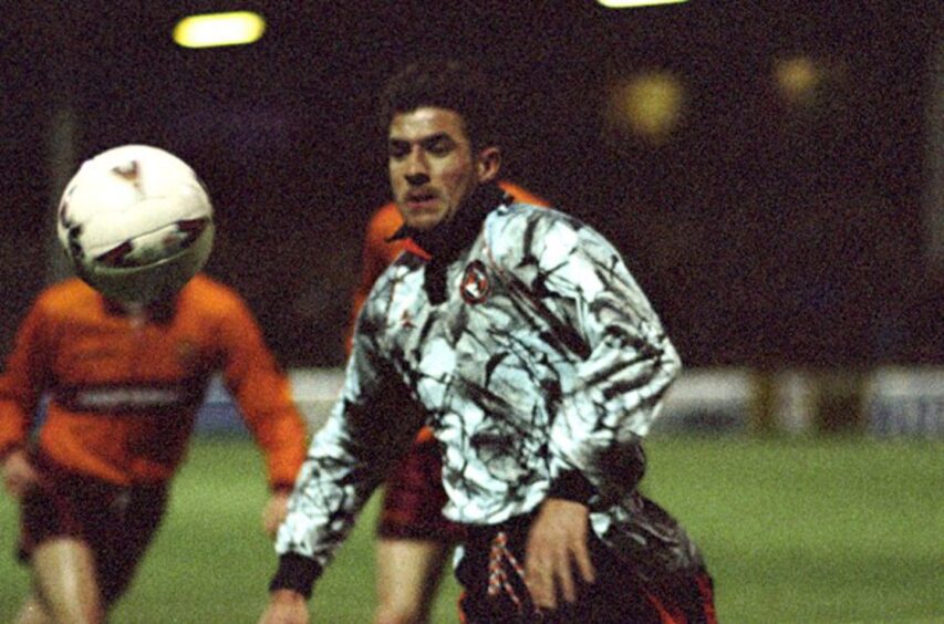 Former Dundee United attacker Craig Brewster in action against Motherwell