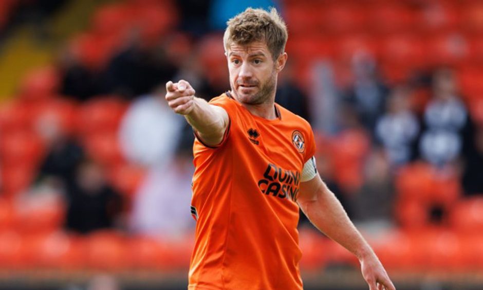 Dundee United's Ross Docherty gives out instructions