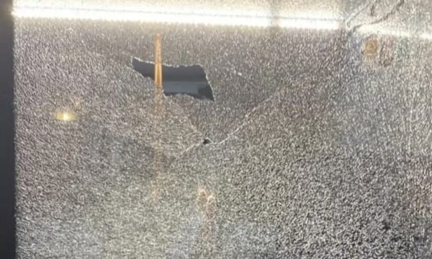 Stagecoach bus shattered window.