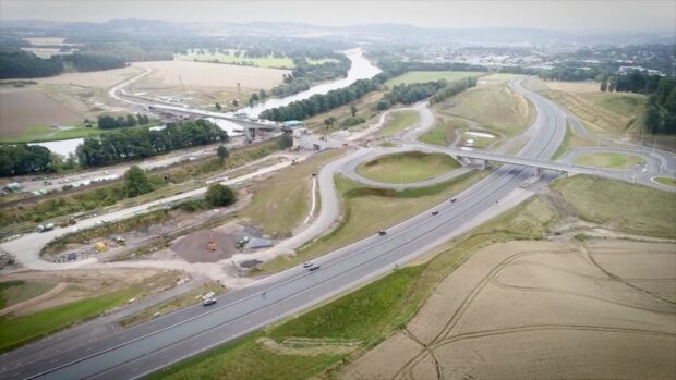 Aerial view, showing roads connecting the A9 to the new Destiny Bridge across River Tay and the Cross Tay Link Road beyond.