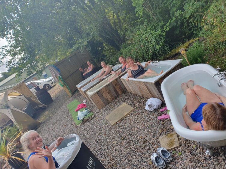 Debbie and the other participants braving the cold water plunge baths at Viking Heat Retreat