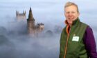 Thomas Haywood with one of his shots of Dunfermline Abbey. Image: FSB